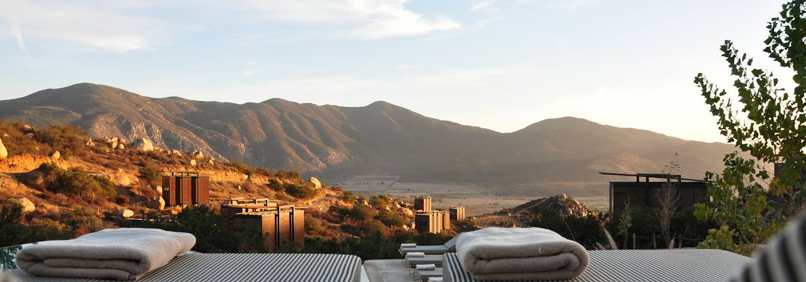 Resort pool at dusk in a hot, long-season climate