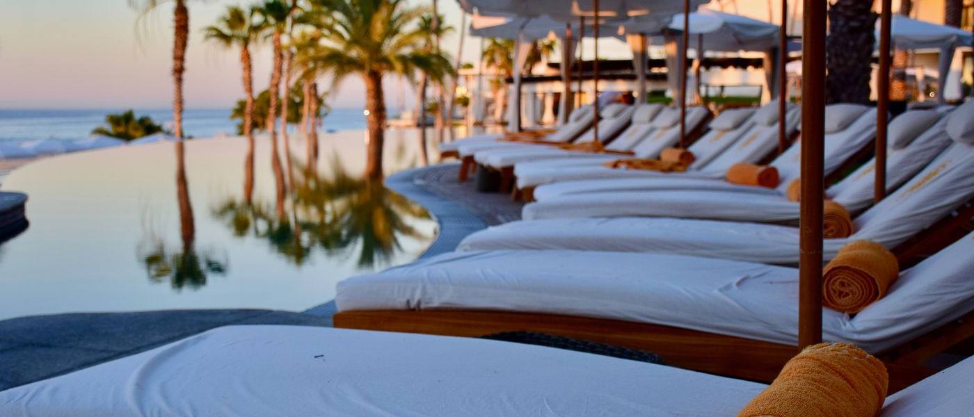 Well-kept resort pool deck — the professional standard